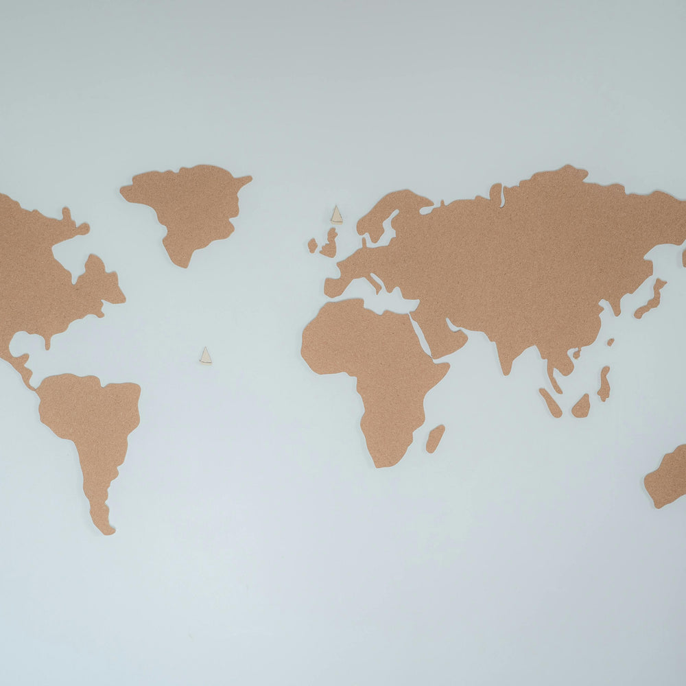 world map with continents highlighted in gold