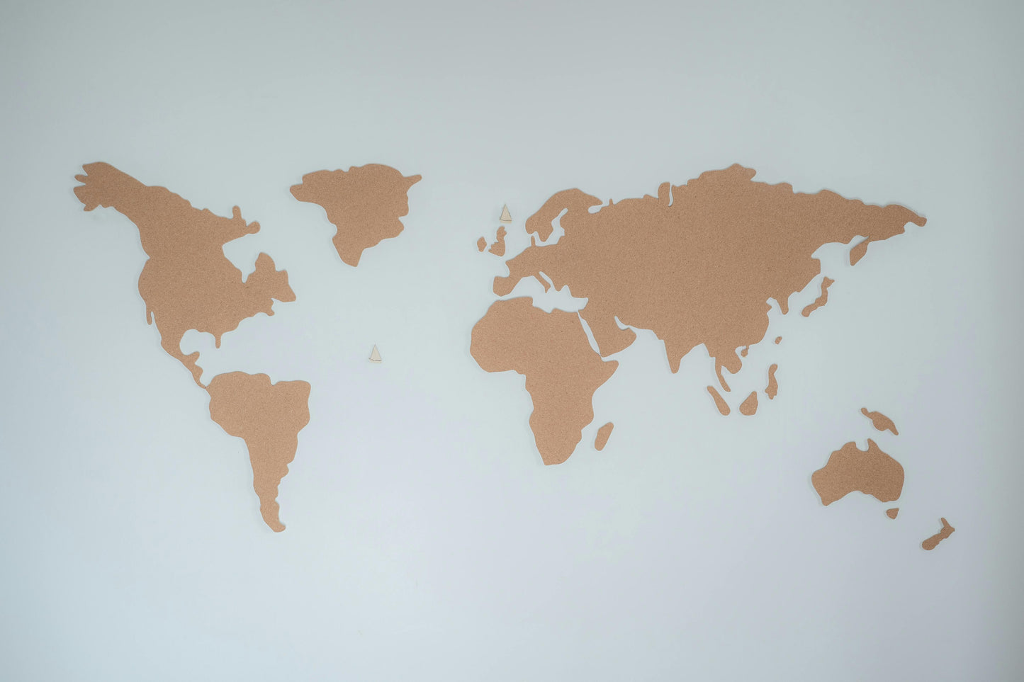 world map with continents highlighted in gold