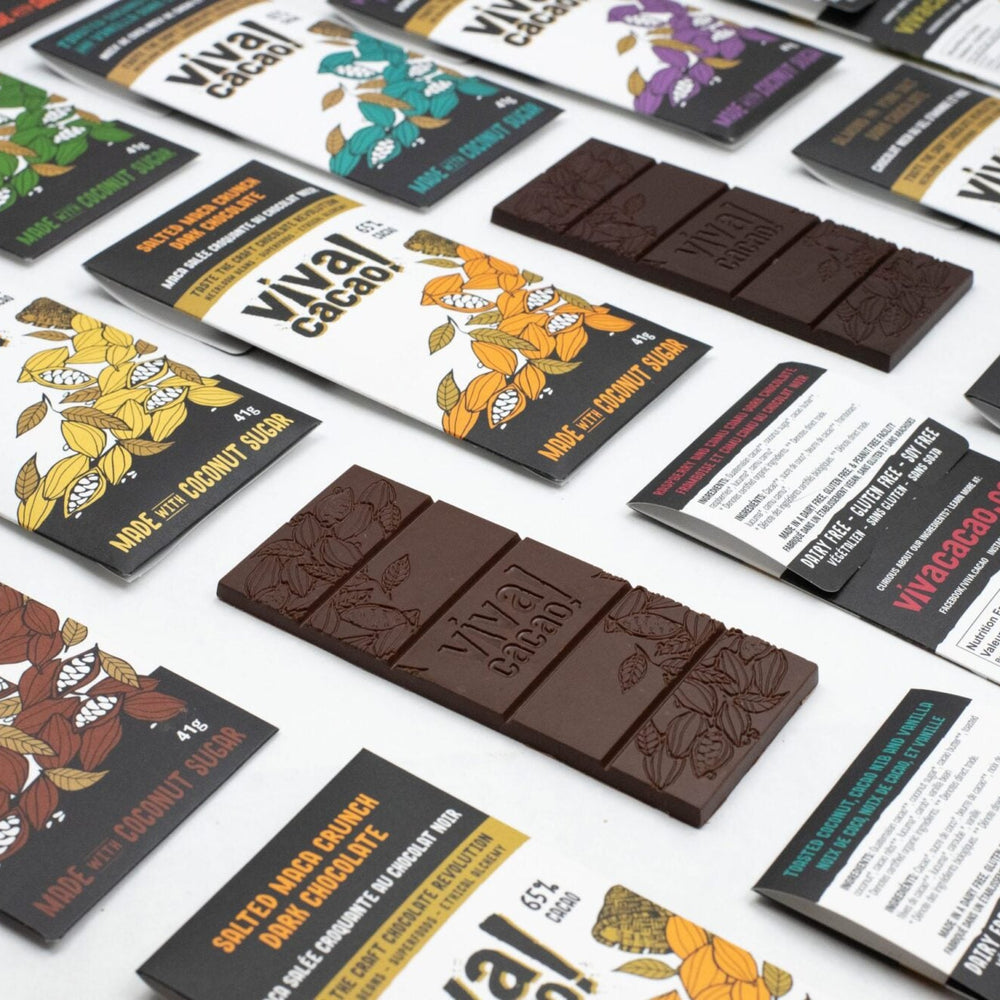 
                  
                    Flat lay of six assorted Viva Cacao chocolate bars featuring superfood ingredients and bold flavours
                  
                
