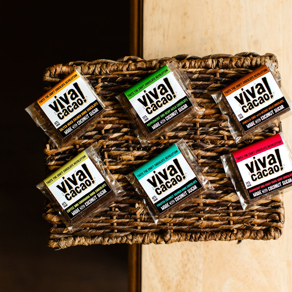 
                  
                    Close-up of Viva Cacao’s assorted mini bars featuring bold packaging and vibrant flavour labels - Viva Cacao!
                  
                